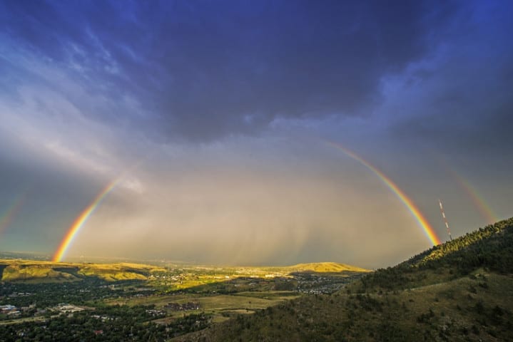 Rainbow Over Denver. Colorado Stormy Sky with Colorful Full Rainbow. Scenic View From the Lookout Mountain, Golden, Colorado, United States.